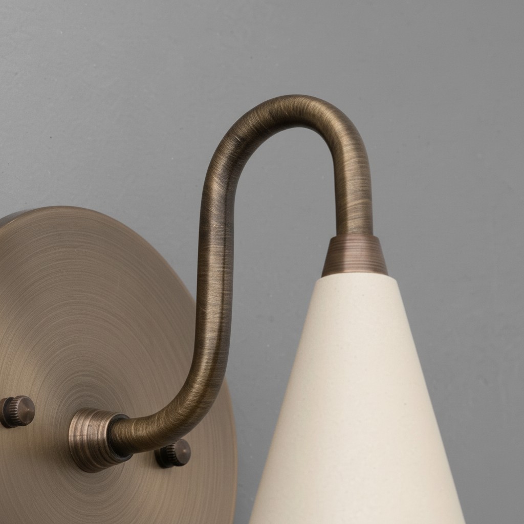 Curva Metal sconce detail with cone shade