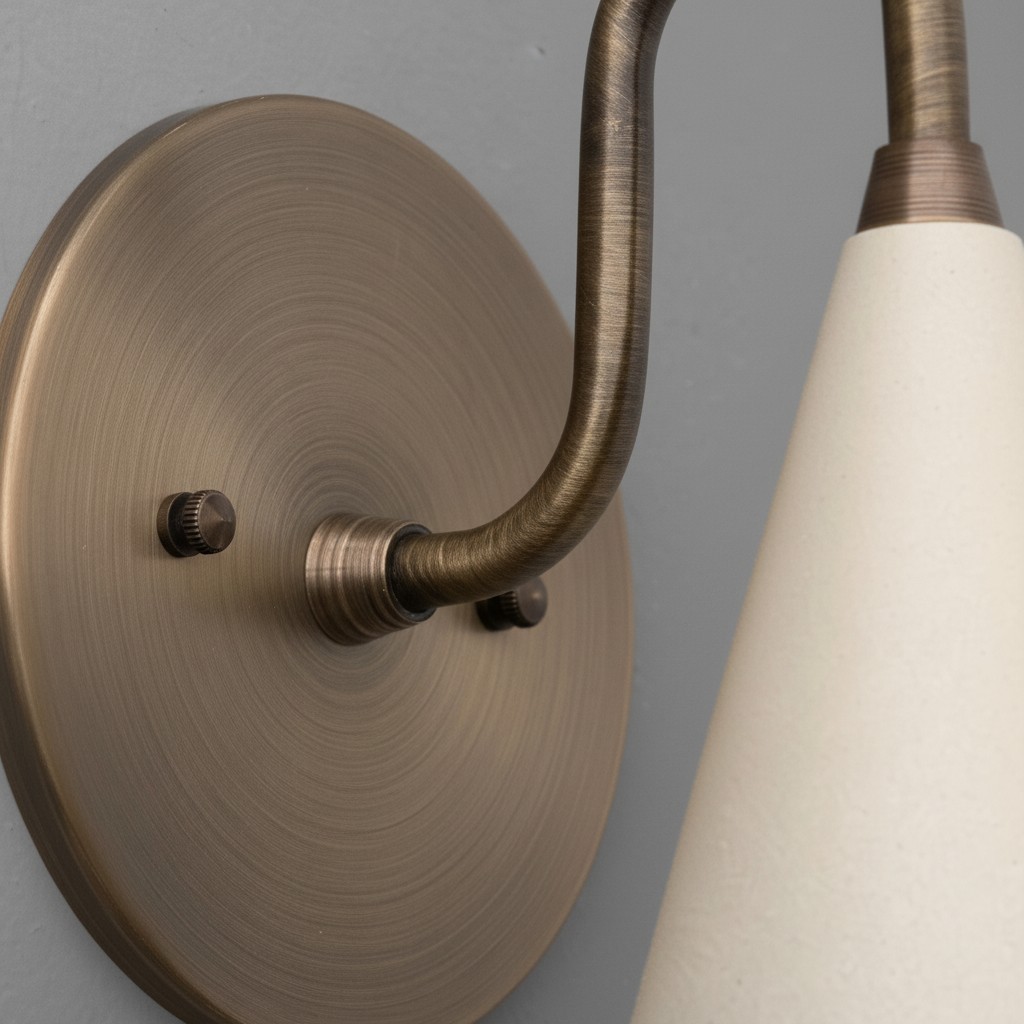 Close-up of Curva Metal wall plate and curved arm