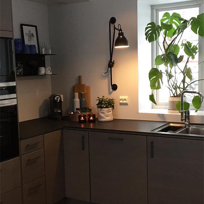 Wall light illuminating a kitchen corner