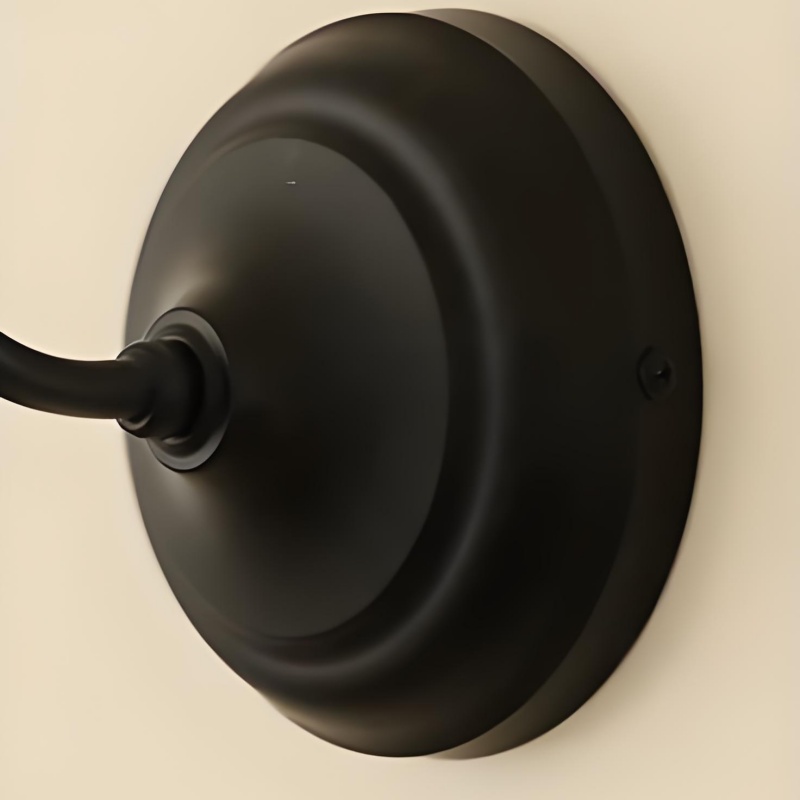Detalle del soporte circular negro de la lámpara Cazelle