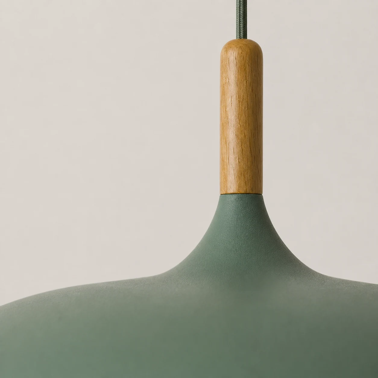 Close-up detail of the wood and aluminum pendant light finish