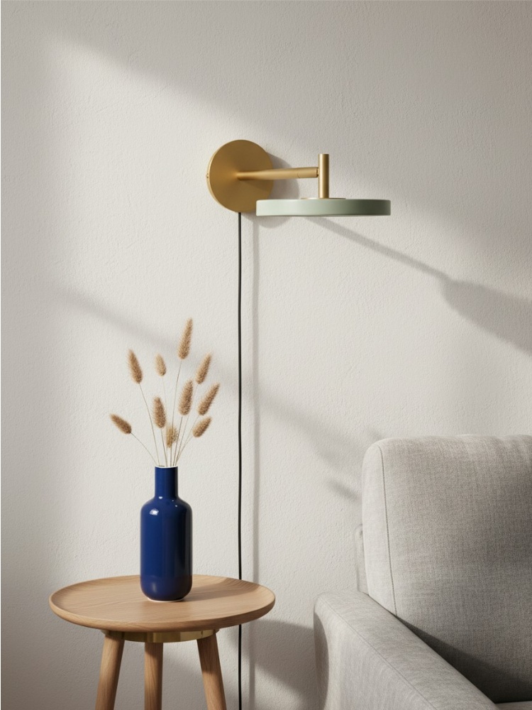 Asteria wall light above a side table near a sofa