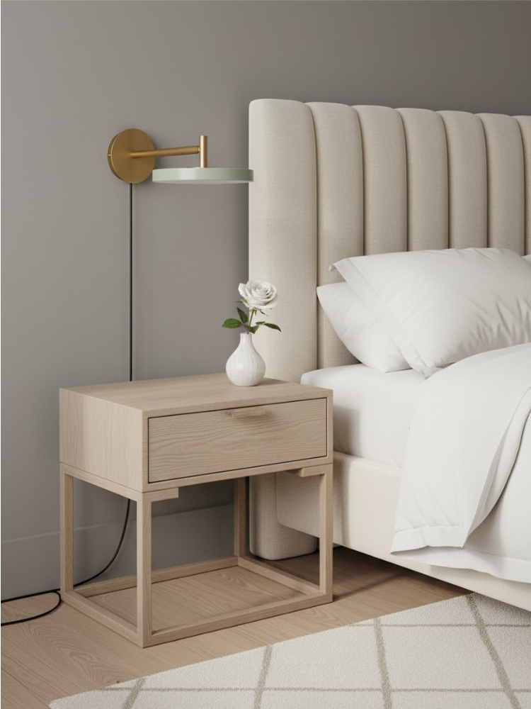 Asteria wall light installed above a bedside table