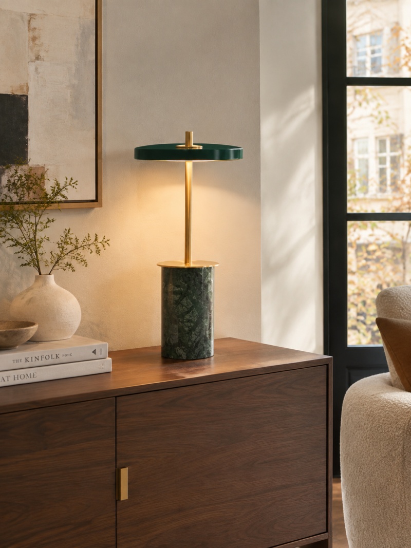 Asteria dark green marbled lamp on a dark wood console