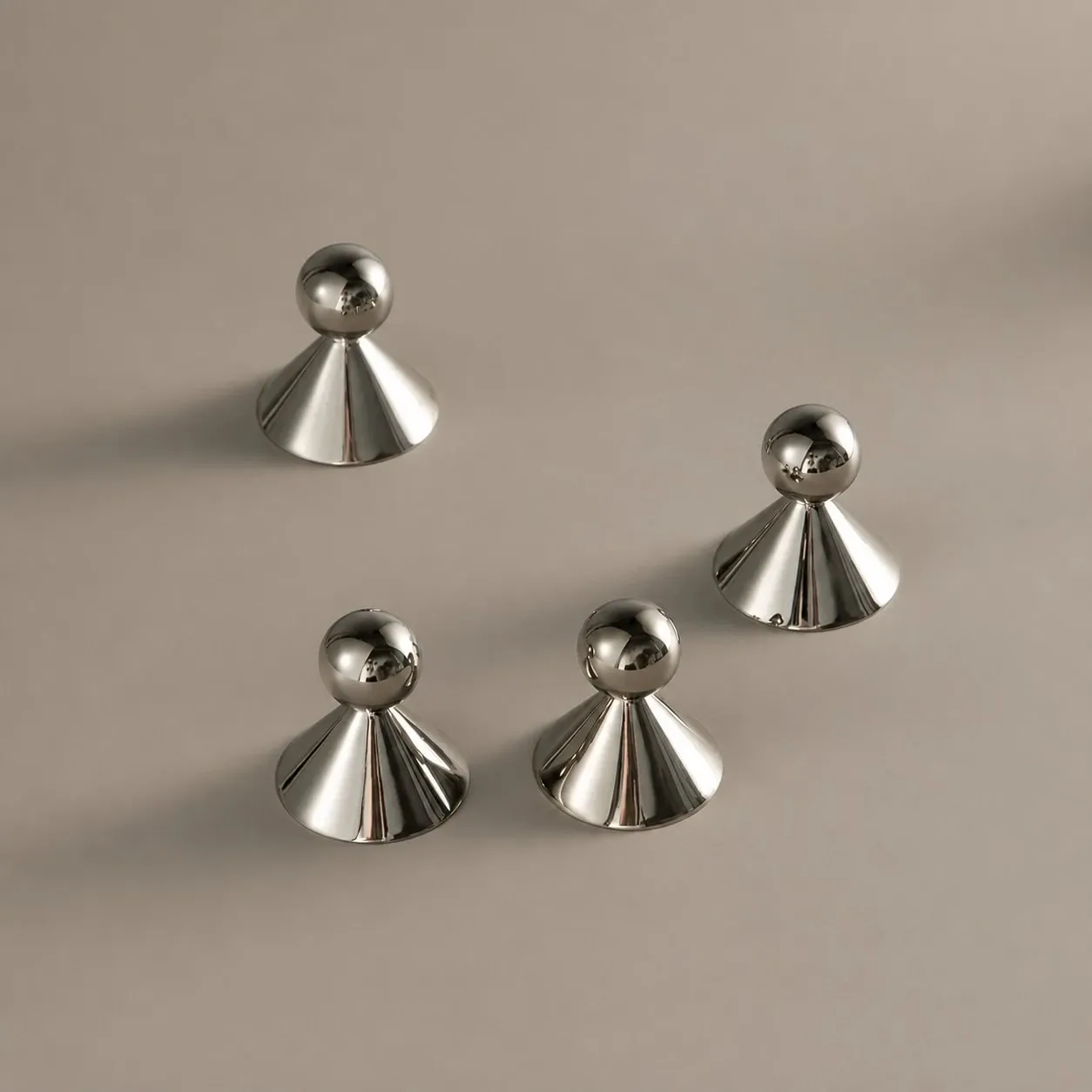 Polished silver-tone surface of the brass cabinet knobs