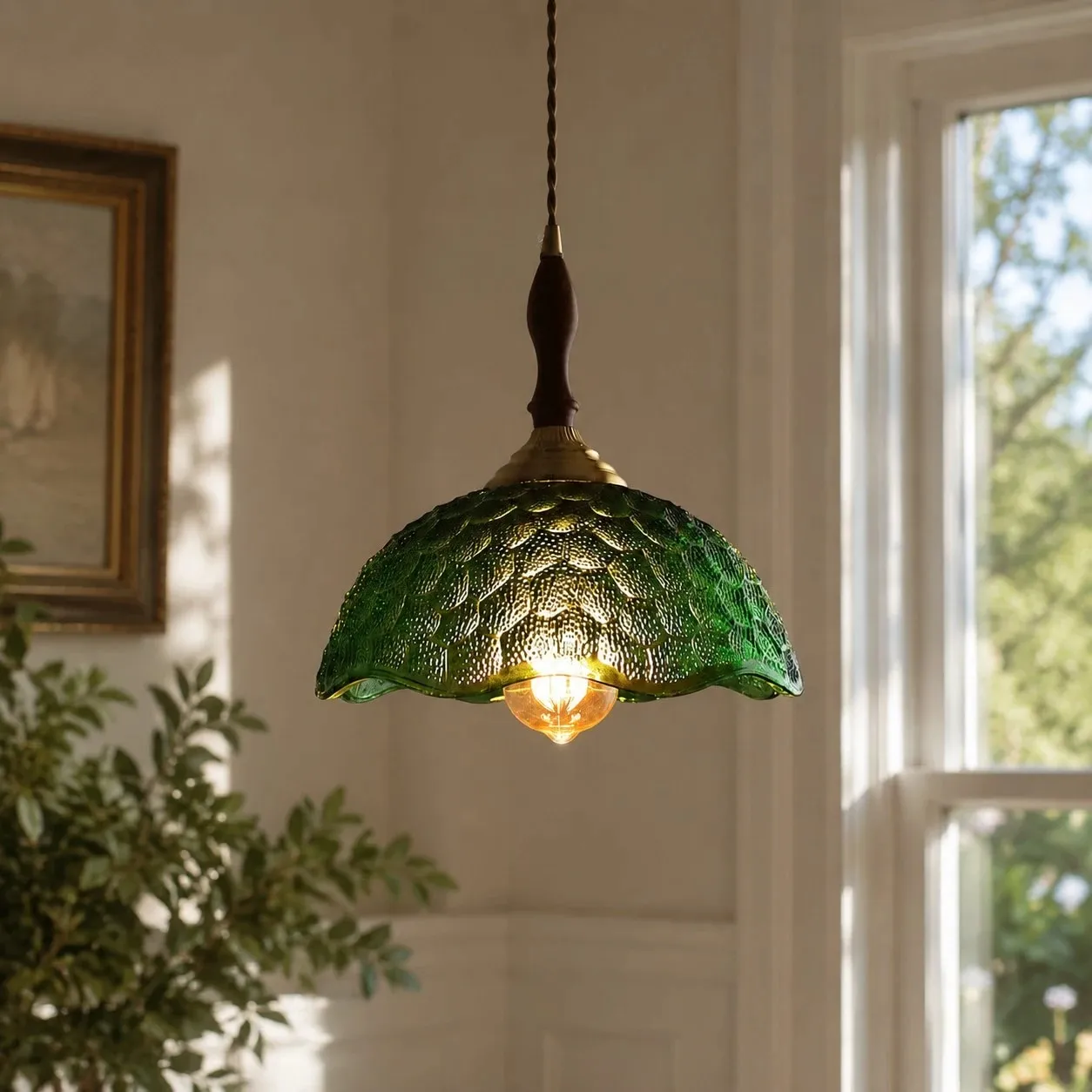 Green glass pendant by windows