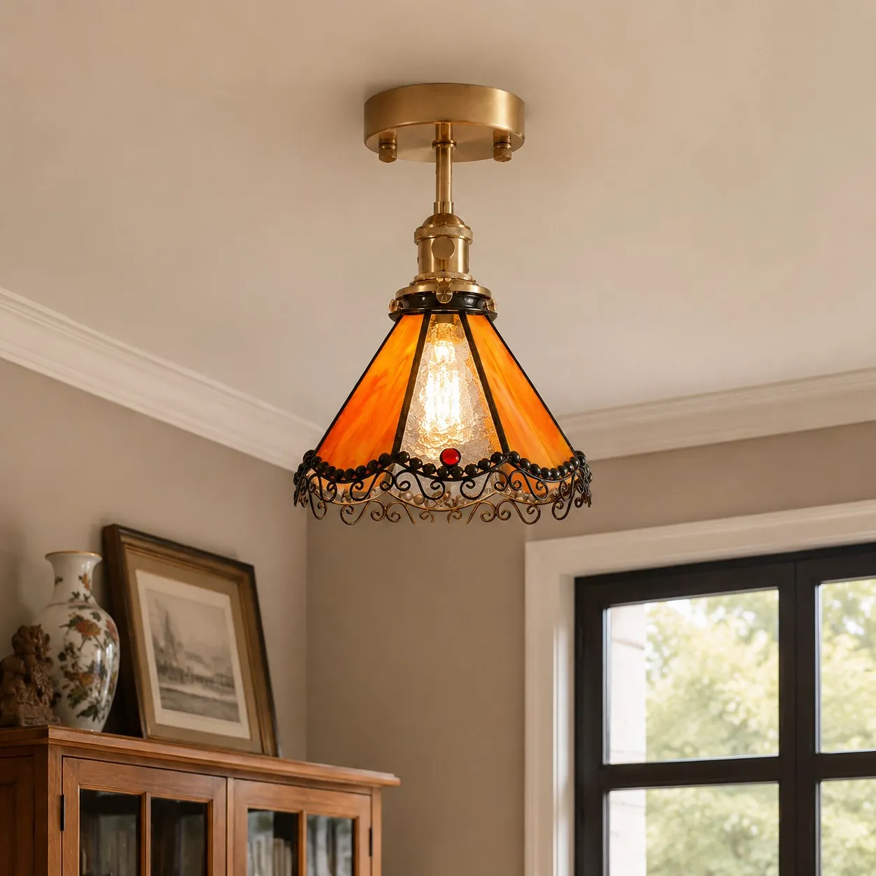 Orange stained glass ceiling light above a cabinet corner