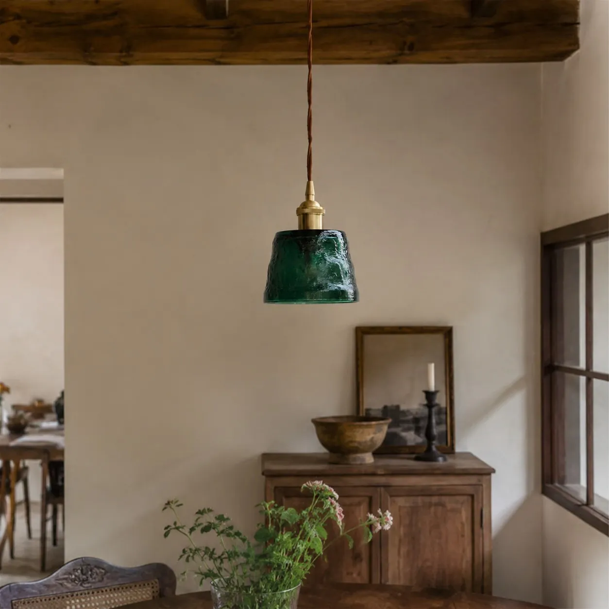 Green glass pendant light in a warm home setting
