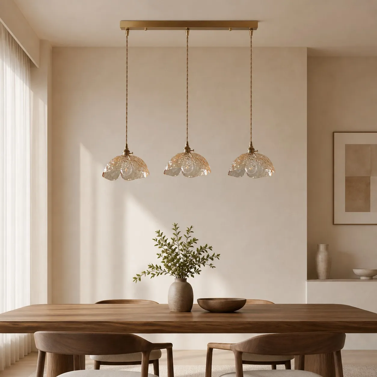 Three clear flower pendants over a wood dining table