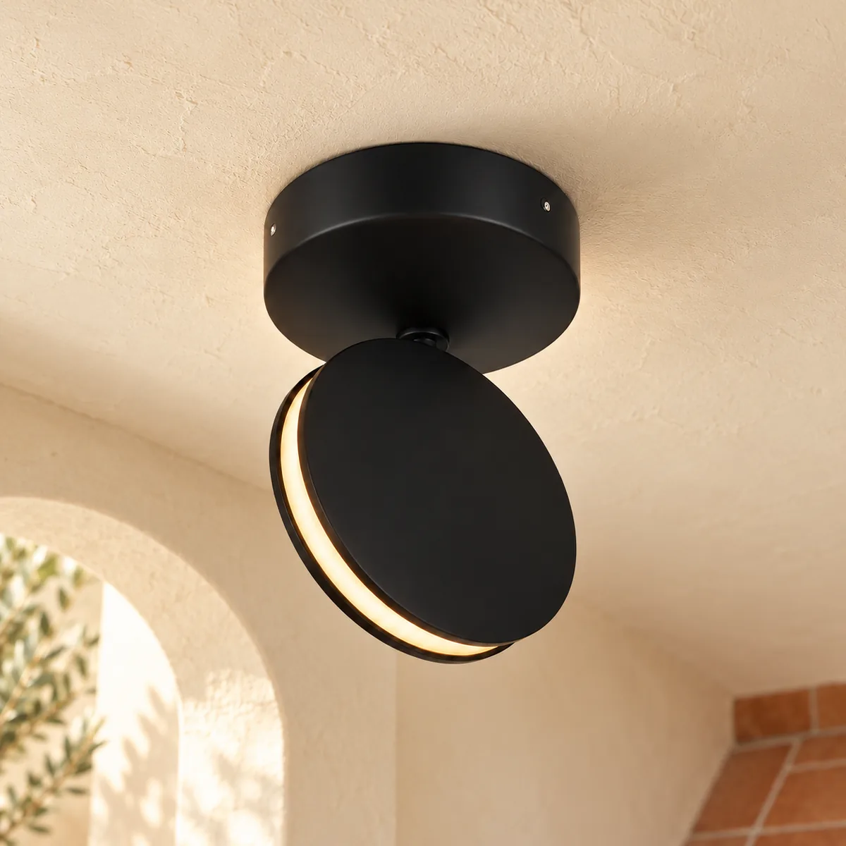 Black aluminium disc LED mounted on the ceiling